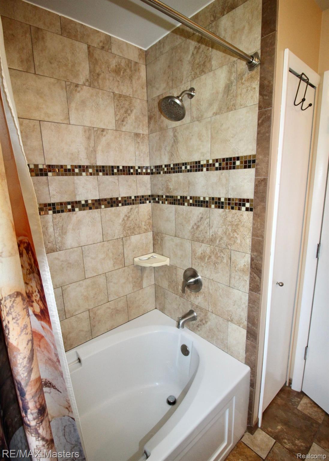46355 Wear Road Belleville, MI 48111 - Photo 15 of 46 Tiled tub/shower.