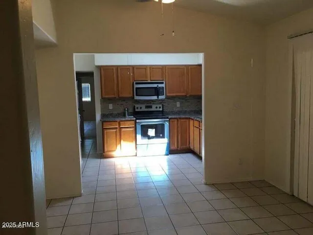 a kitchen with stainless steel appliances a sink and a stove top oven