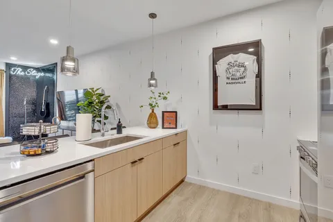 a bathroom with a double vanity sink and a mirror