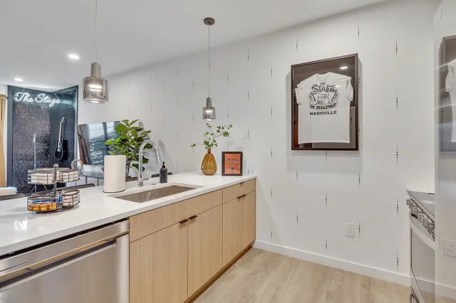 a bathroom with a double vanity sink and a mirror