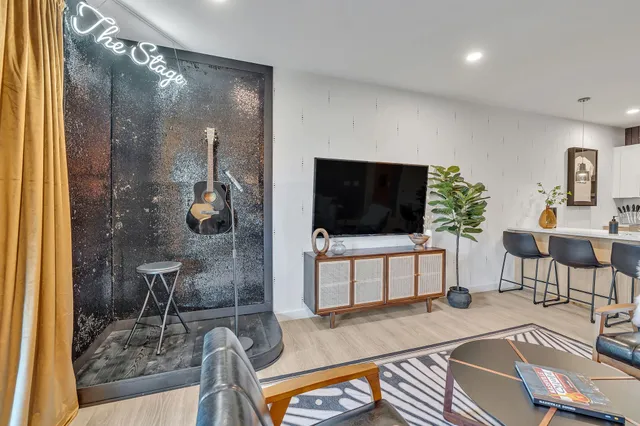 a living room with furniture and a flat screen tv