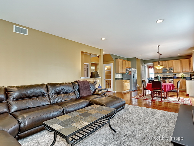 1463 Saddleridge Place Bartlett, IL 60103 - Photo 15 of 27 a living room with furniture and a view of living room