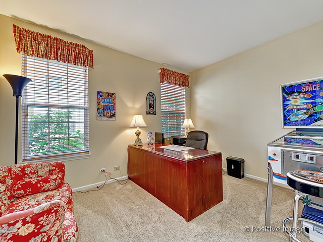 1463 Saddleridge Place Bartlett, IL 60103 - Photo 16 of 27 a room with furniture and a window