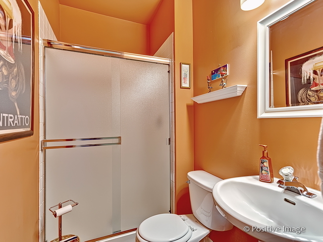 1463 Saddleridge Place Bartlett, IL 60103 - Photo 17 of 27 a bathroom with a sink toilet and shower