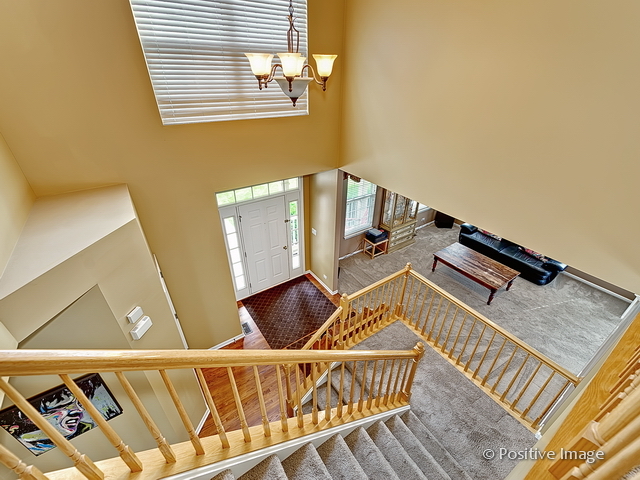 1463 Saddleridge Place Bartlett, IL 60103 - Photo 3 of 27 a view of an entryway with furniture