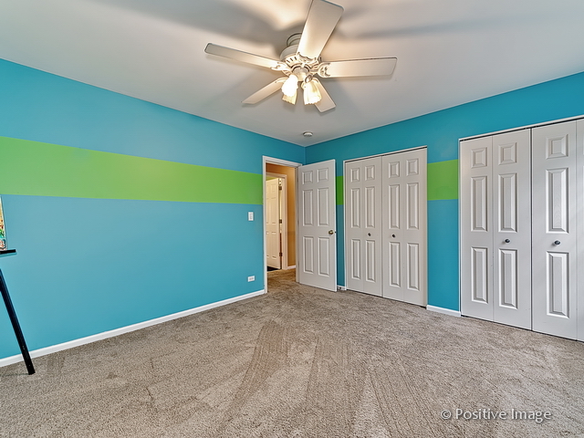 1463 Saddleridge Place Bartlett, IL 60103 - Photo 22 of 27 a view of an empty room with a window