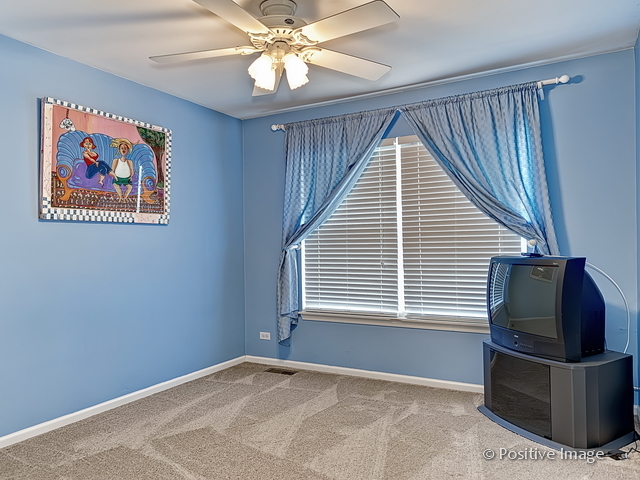 1463 Saddleridge Place Bartlett, IL 60103 - Photo 23 of 27 a view of livingroom with workspace and window