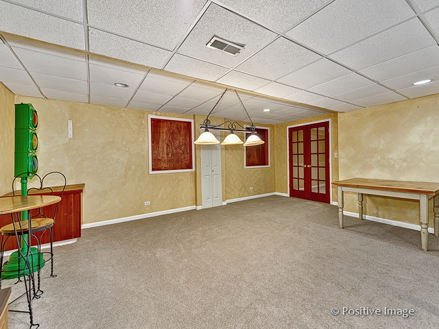 1463 Saddleridge Place Bartlett, IL 60103 - Photo 25 of 27 a view of an empty room with a fireplace