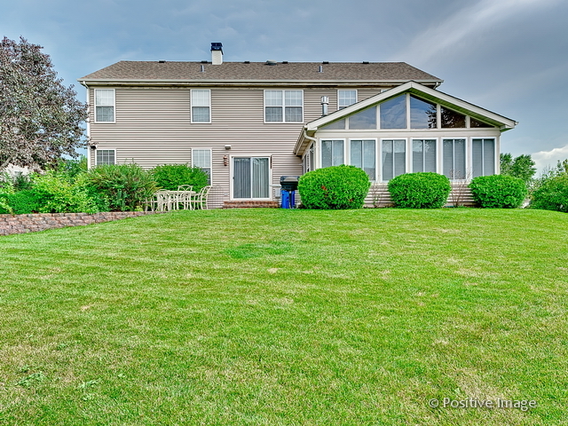 1463 Saddleridge Place Bartlett, IL 60103 - Photo 27 of 27 a front view of a house with a yard
