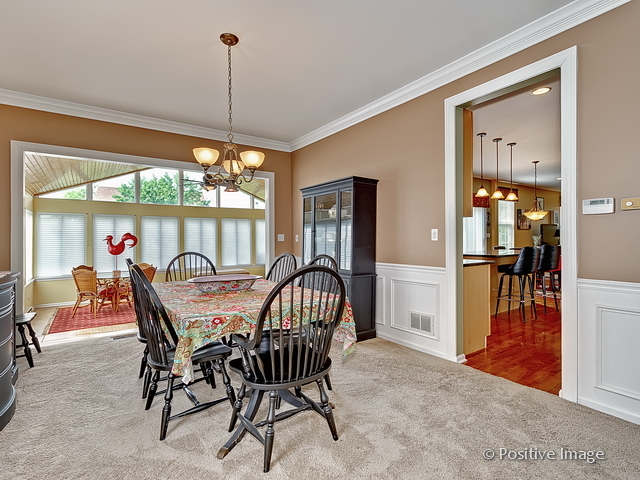 1463 Saddleridge Place Bartlett, IL 60103 - Photo 7 of 27 a dining room with furniture and window