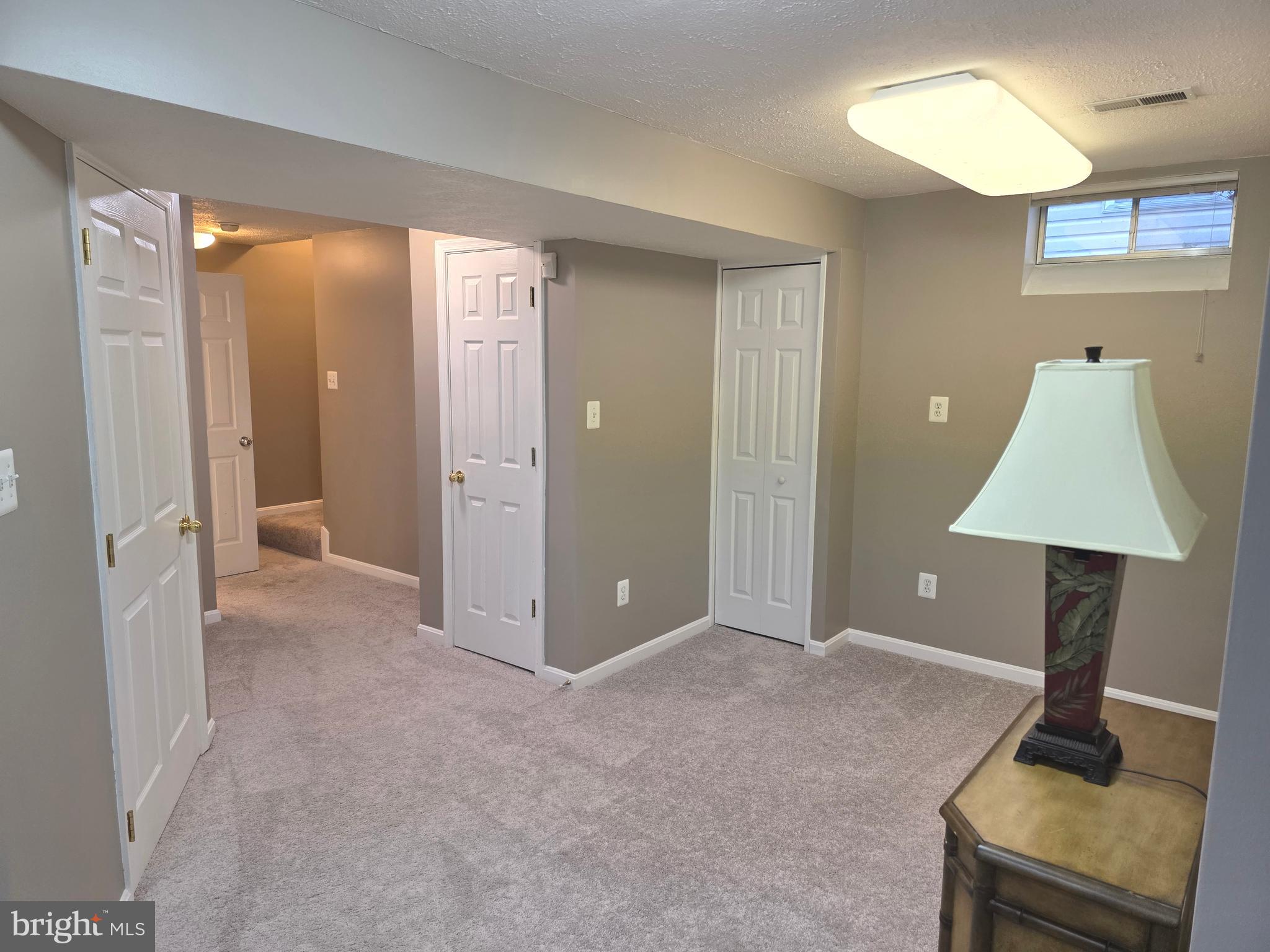 2441 Kemper Road Crofton, MD 21114 - Photo 52 of 63 a view of a room with wooden floor and cabinet