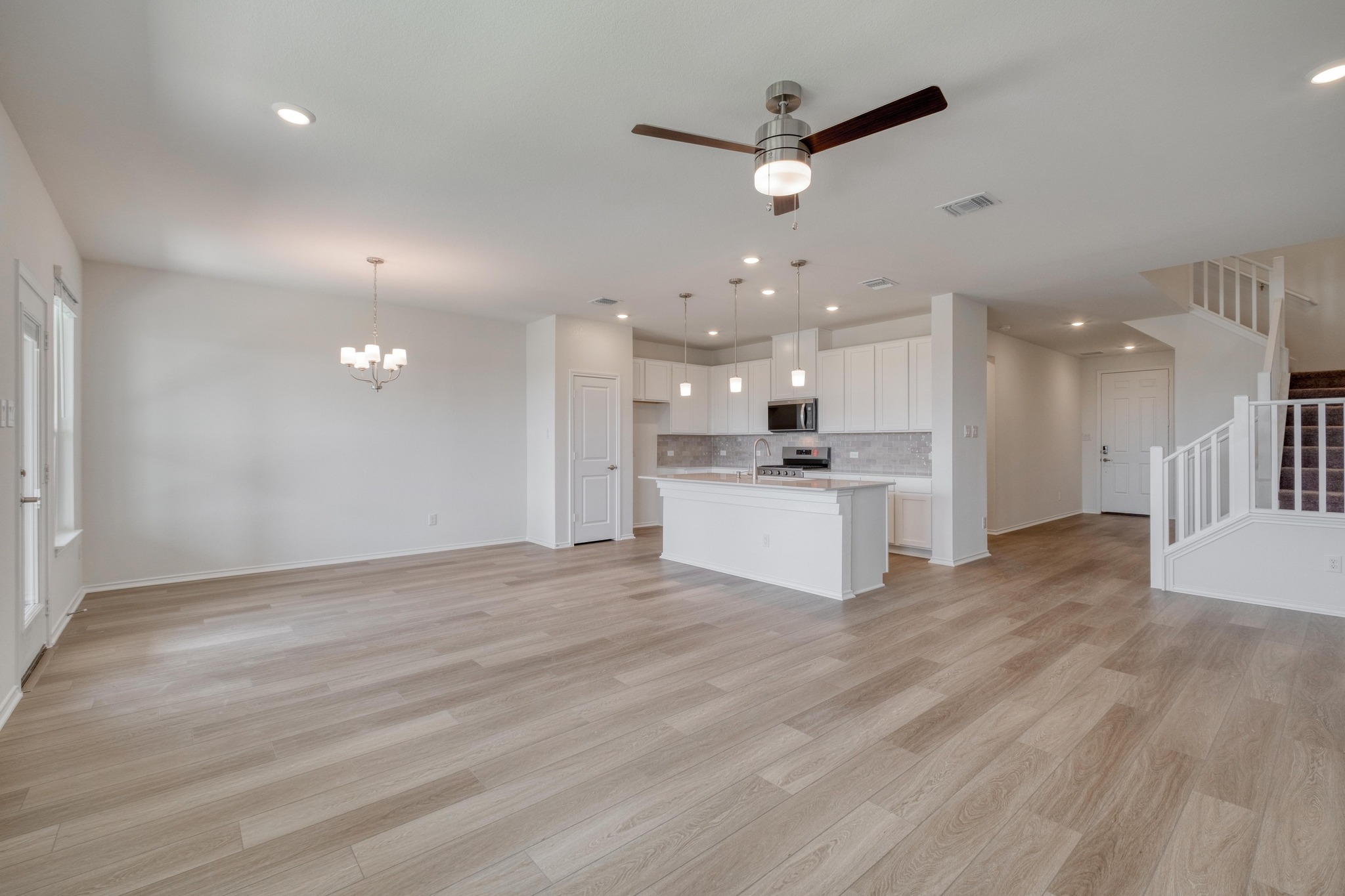 4608 Centola Loop Round Rock, TX 78665 - Photo 11 of 33 a view of kitchen with kitchen island white cabinets and refrigerator