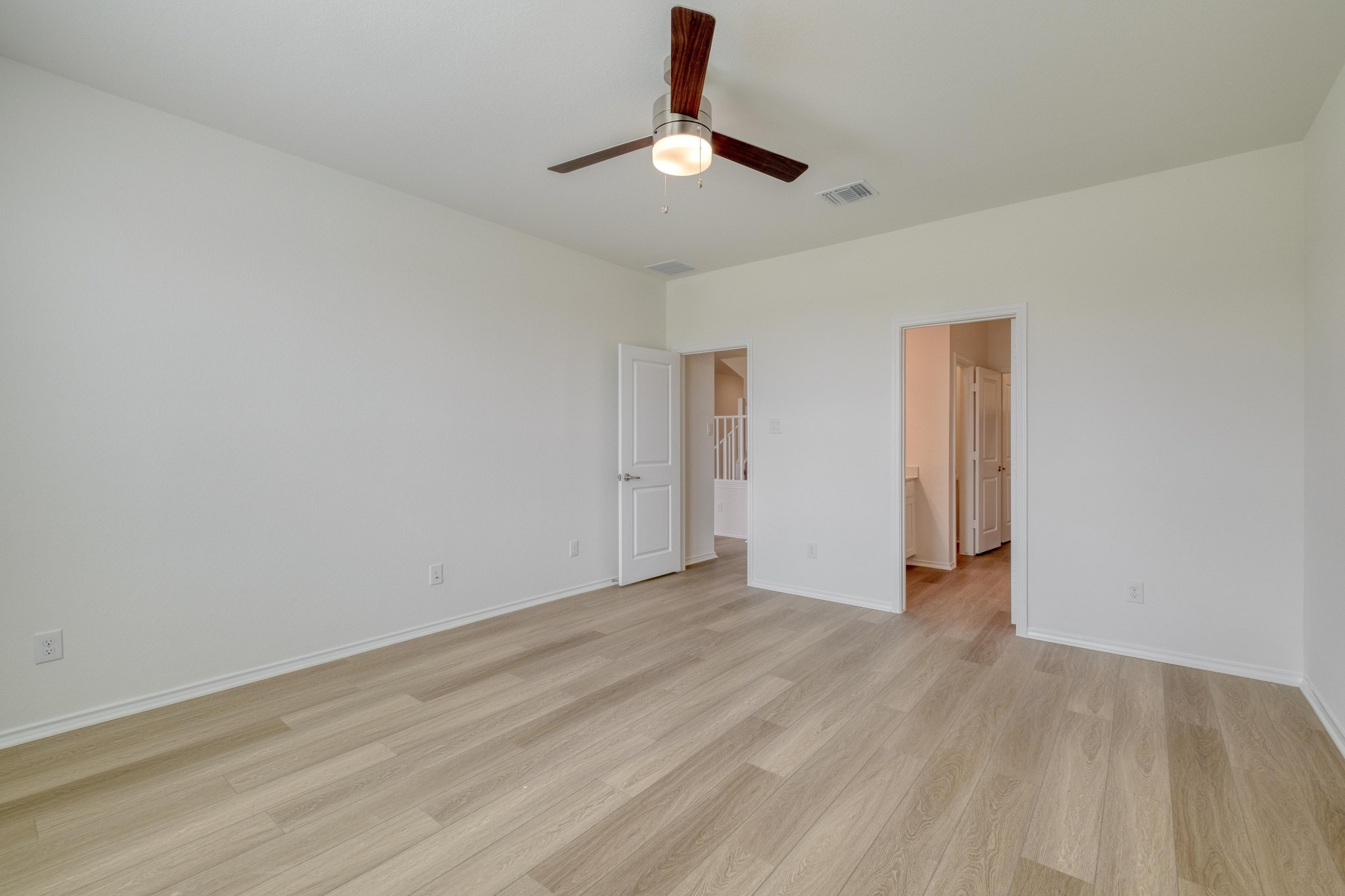 4608 Centola Loop Round Rock, TX 78665 - Photo 15 of 33 a view of an empty room with wooden floor