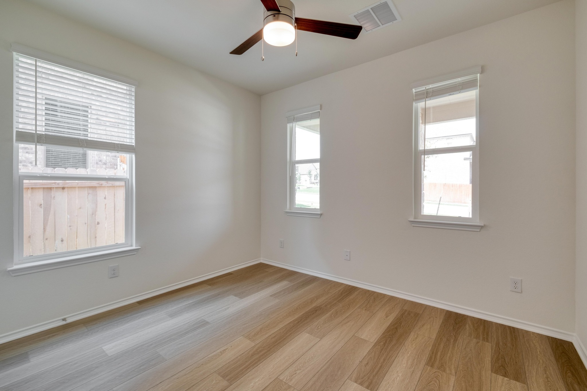 4608 Centola Loop Round Rock, TX 78665 - Photo 19 of 33 a view of empty room with wooden floor and fan