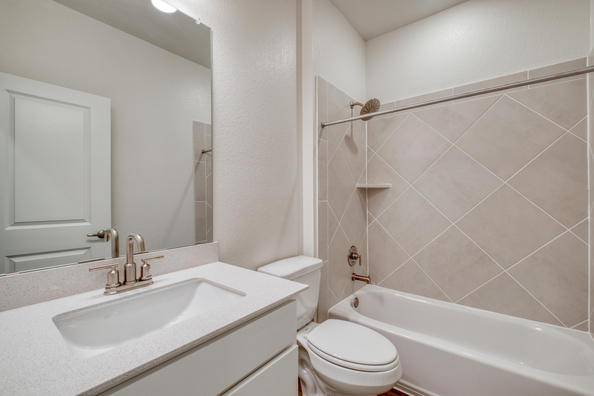 4608 Centola Loop Round Rock, TX 78665 - Photo 20 of 33 a bathroom with a sink toilet vanity and shower