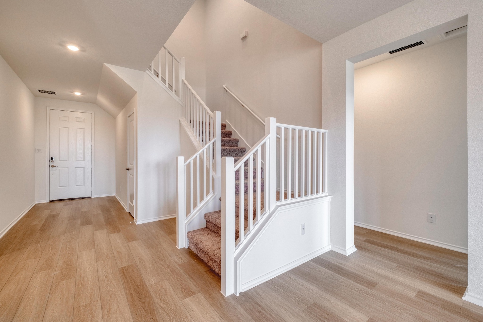 4608 Centola Loop Round Rock, TX 78665 - Photo 21 of 33 a view of a hallway with wooden floor and staircase