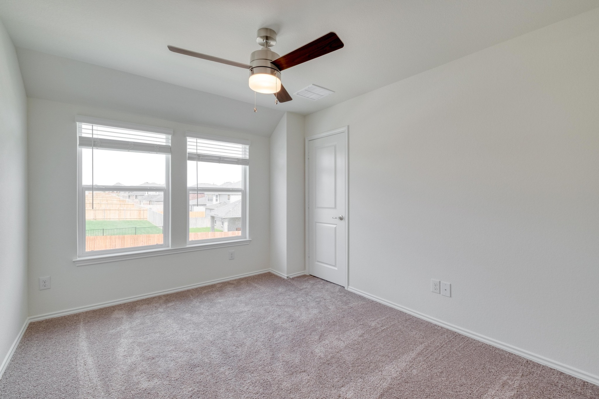 4608 Centola Loop Round Rock, TX 78665 - Photo 25 of 33 an empty room with a ceiling fan and windows