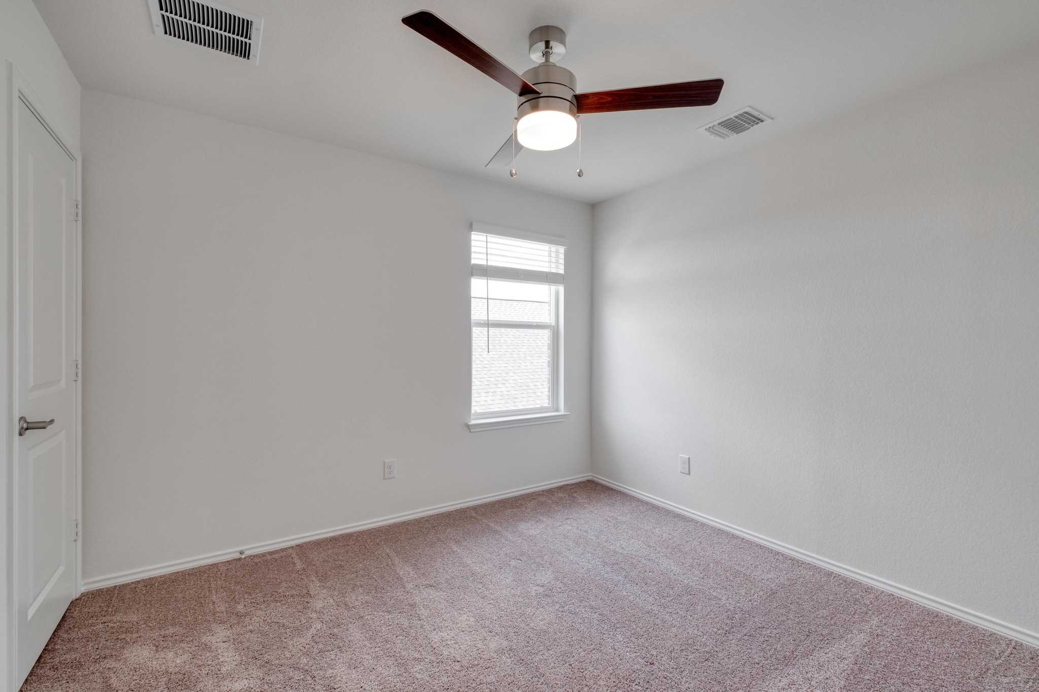 4608 Centola Loop Round Rock, TX 78665 - Photo 26 of 33 an empty room with a window and a fan
