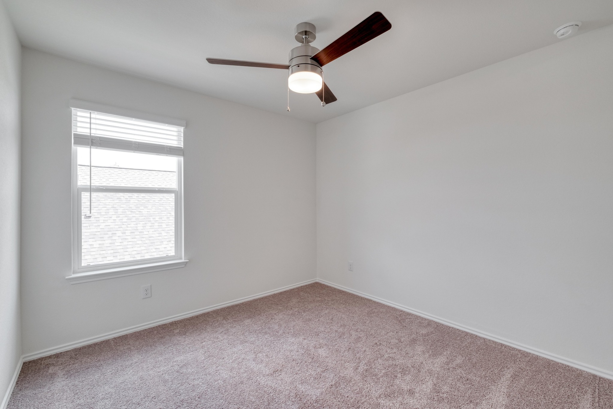 4608 Centola Loop Round Rock, TX 78665 - Photo 27 of 33 an empty room with a window and a fan