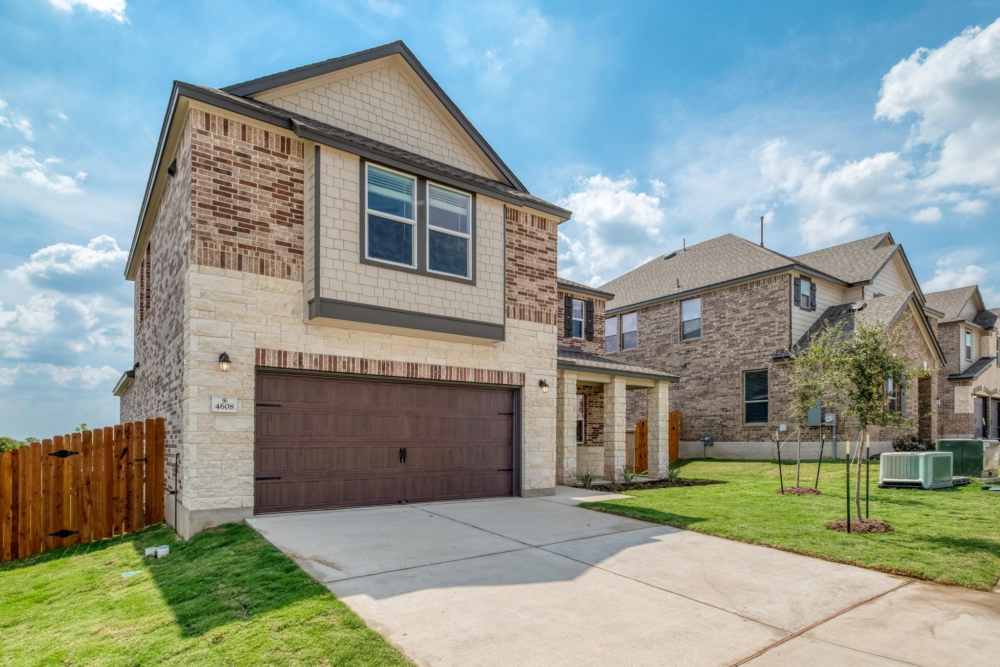 4608 Centola Loop Round Rock, TX 78665 - Photo 3 of 33 a front view of a house with a yard and garage