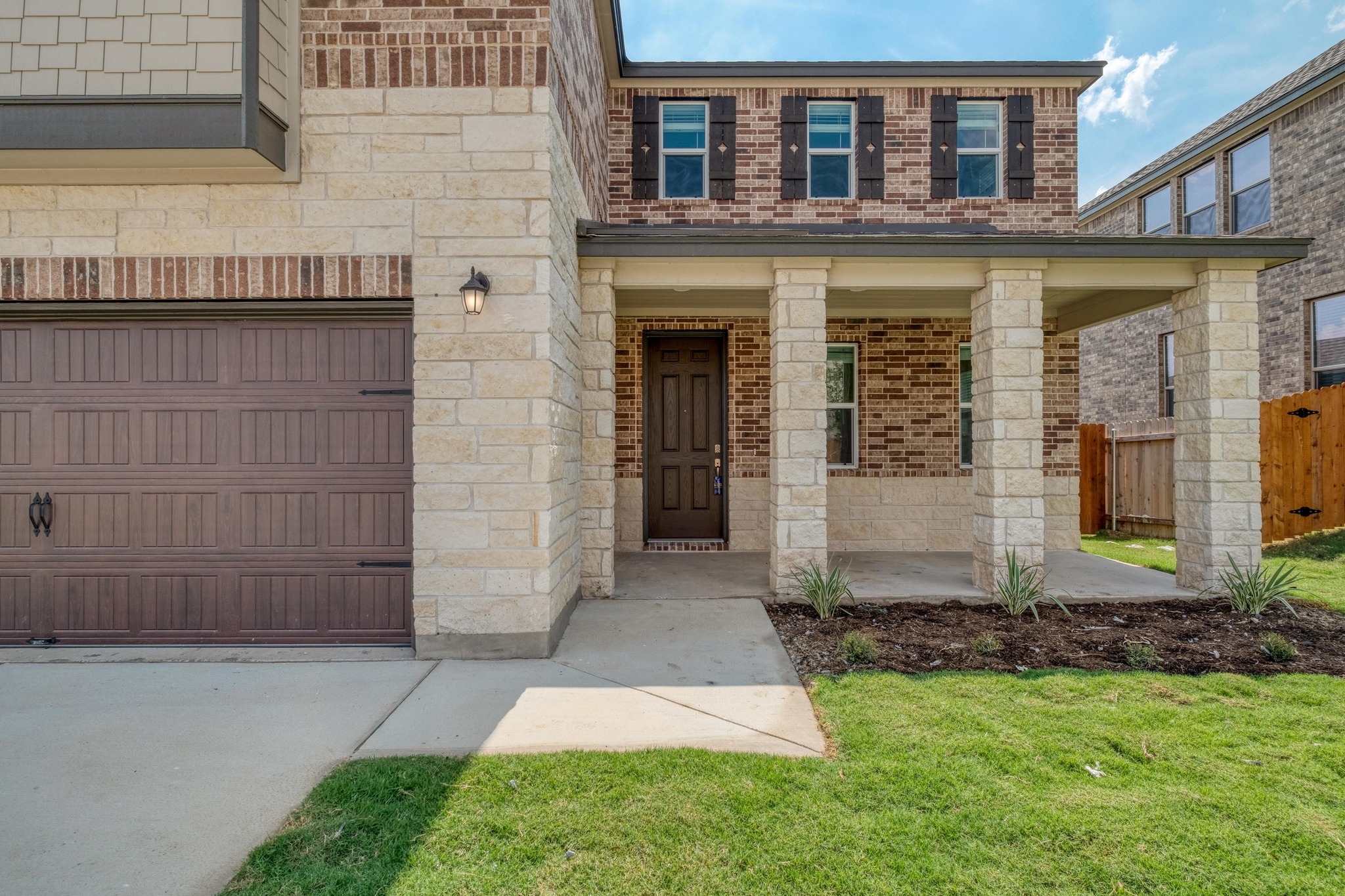 4608 Centola Loop Round Rock, TX 78665 - Photo 4 of 33 a front view of a house with a garden