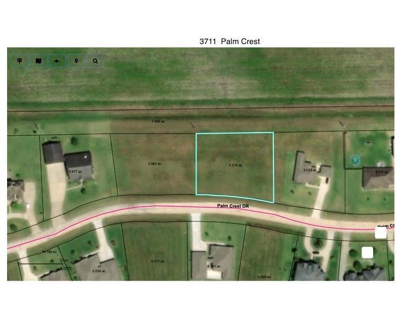 3711 Palm Crest Drive Rosharon, TX 77583 - Photo 6 of 9 This aerial photo shows a vacant lot measuring 0.576 acres on Palm Crest Drive, surrounded by neighboring homes. It's a spacious plot in a residential area, ideal for building a new home.