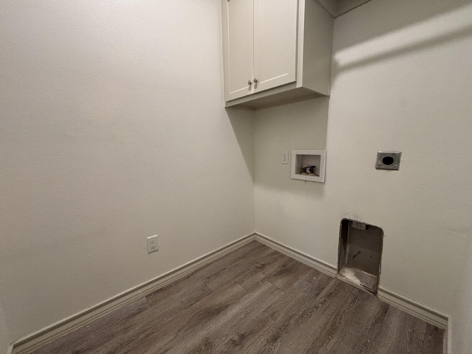 2407 Quitman Avenue, Unit B Lubbock, TX 79407 - Photo 12 of 13 a view of a small space with wooden floor and a window