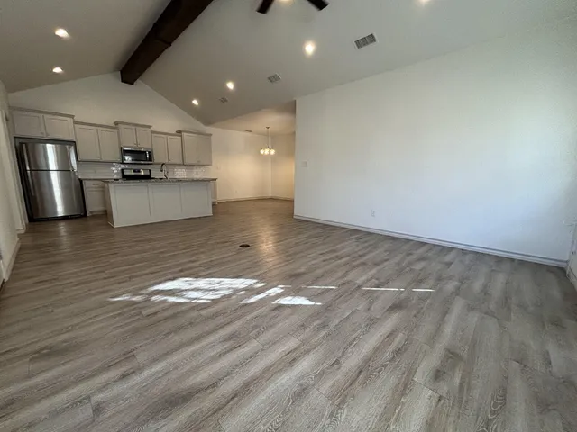 a view of kitchen with cabinets and stainless steel appliances