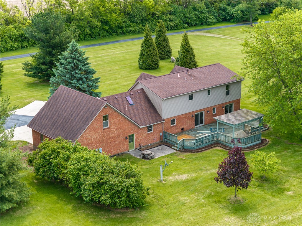 9981 Ridge Acres Lane Englewood, OH 45322 - Photo 69 of 73 This spacious property offers a sprawling yard and a generous deck for outdoor enjoyment.