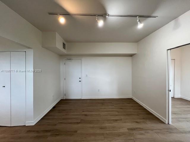 1000 Southwest 12th Court, Unit 4 Miami, FL 33135 - Photo 1 of 21 an empty room with wooden floor and windows