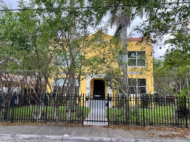 1000 Southwest 12th Court, Unit 4 Miami, FL 33135 - Photo 20 of 21 a front view of a house with a garden