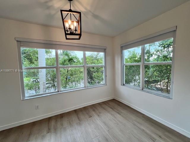 1000 Southwest 12th Court, Unit 4 Miami, FL 33135 - Photo 6 of 21 an empty room with wooden floor and a window