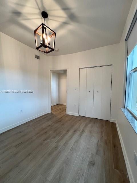 1000 Southwest 12th Court, Unit 4 Miami, FL 33135 - Photo 8 of 21 an empty room with wooden floor and ceiling fan