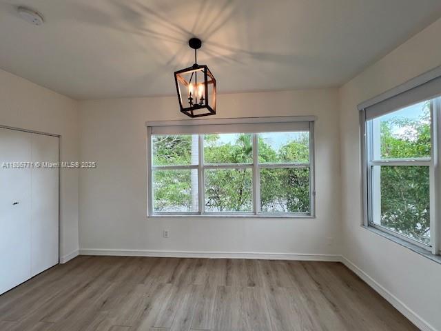 1000 Southwest 12th Court, Unit 4 Miami, FL 33135 - Photo 9 of 21 wooden floor in an empty room with a window
