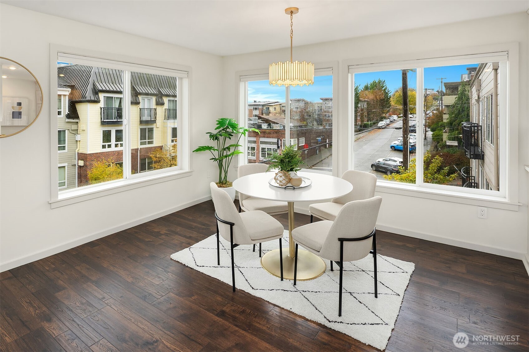 500 Aloha Street, Unit E307 Seattle, WA 98109 - Photo 12 of 28 a view of a dining room with furniture window and wooden floor