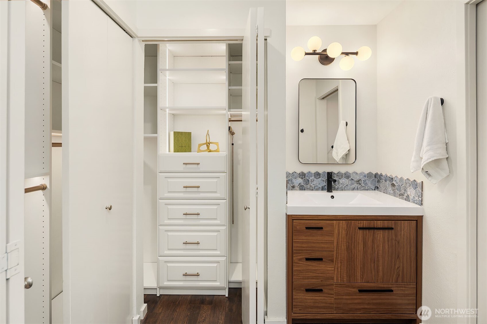 500 Aloha Street, Unit E307 Seattle, WA 98109 - Photo 18 of 28 a bathroom with a double vanity sink a mirror and a shower