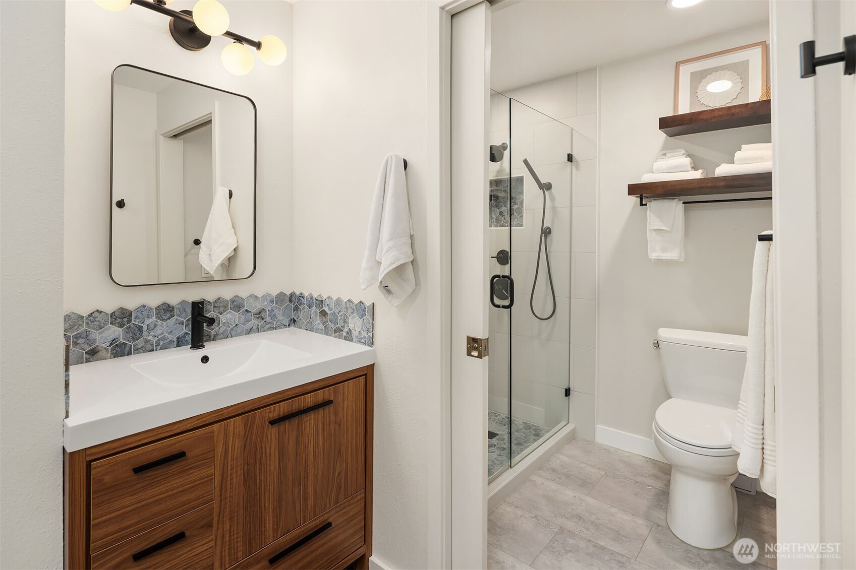 500 Aloha Street, Unit E307 Seattle, WA 98109 - Photo 19 of 28 a bathroom with a toilet sink and shower