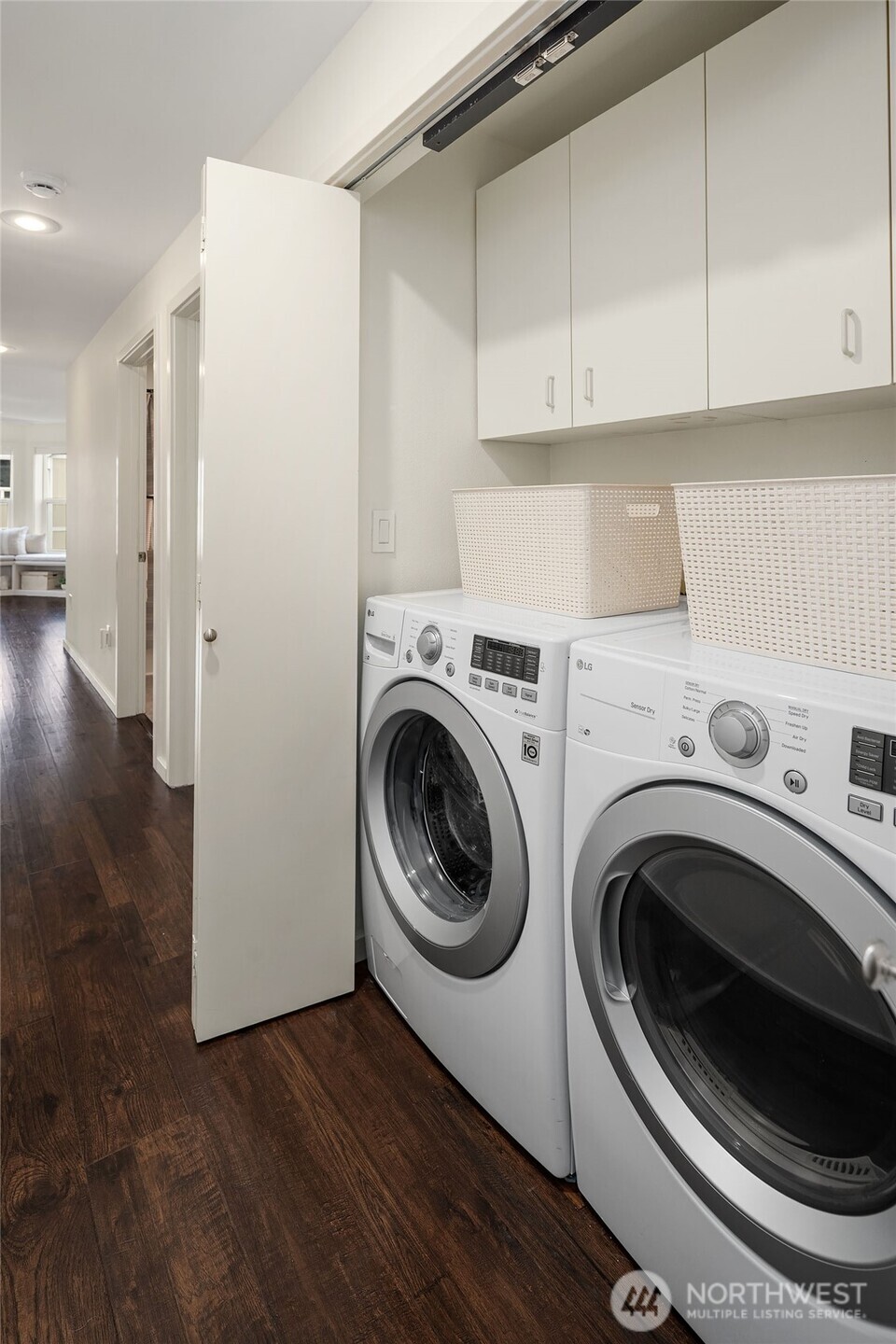 500 Aloha Street, Unit E307 Seattle, WA 98109 - Photo 22 of 28 a view of a storage & utility room with washer and dryer