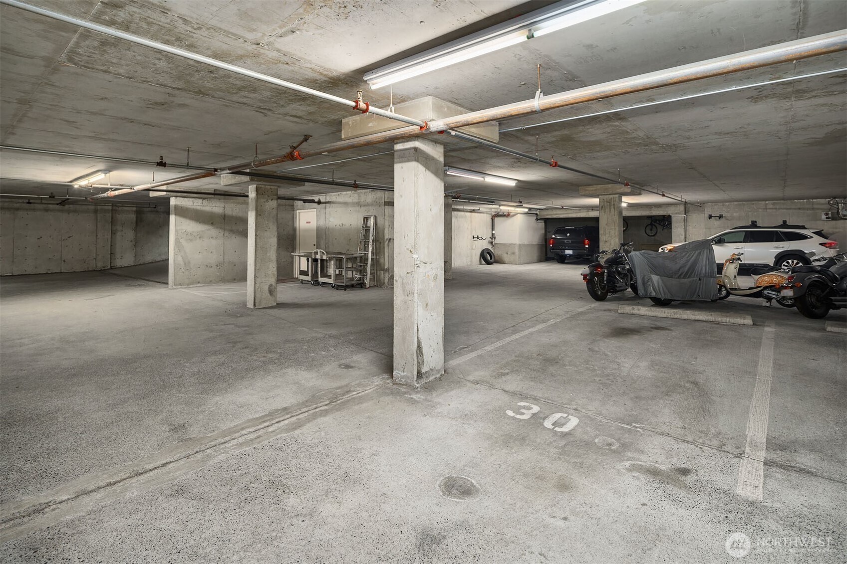 500 Aloha Street, Unit E307 Seattle, WA 98109 - Photo 23 of 28 a view of parking garage with cars