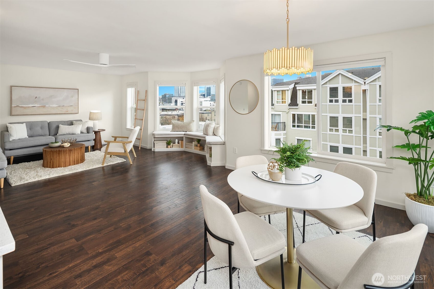 500 Aloha Street, Unit E307 Seattle, WA 98109 - Photo 4 of 28 a view of a dining room with furniture a livingroom and wooden floor