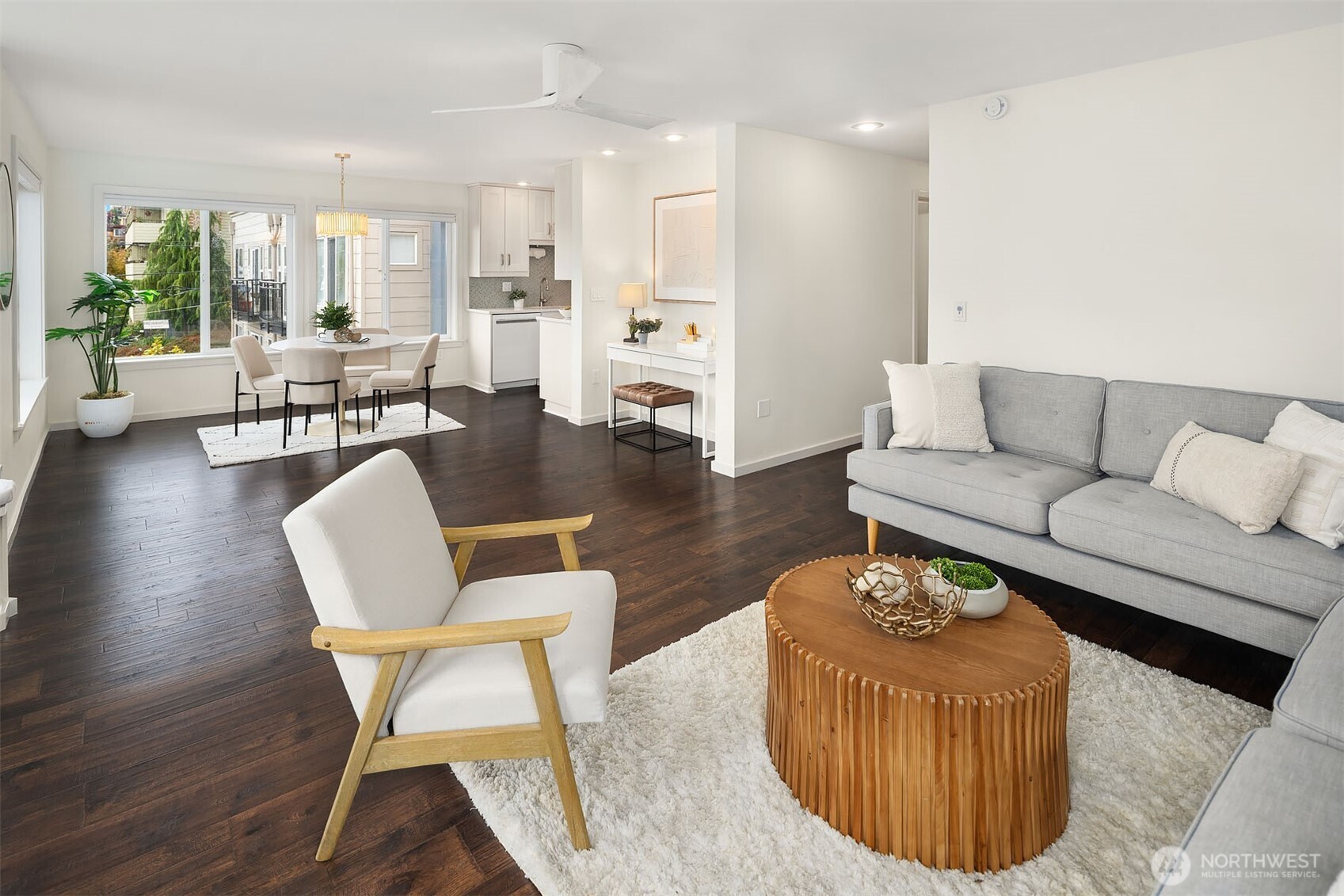 500 Aloha Street, Unit E307 Seattle, WA 98109 - Photo 10 of 28 a living room with furniture wooden floor and a table