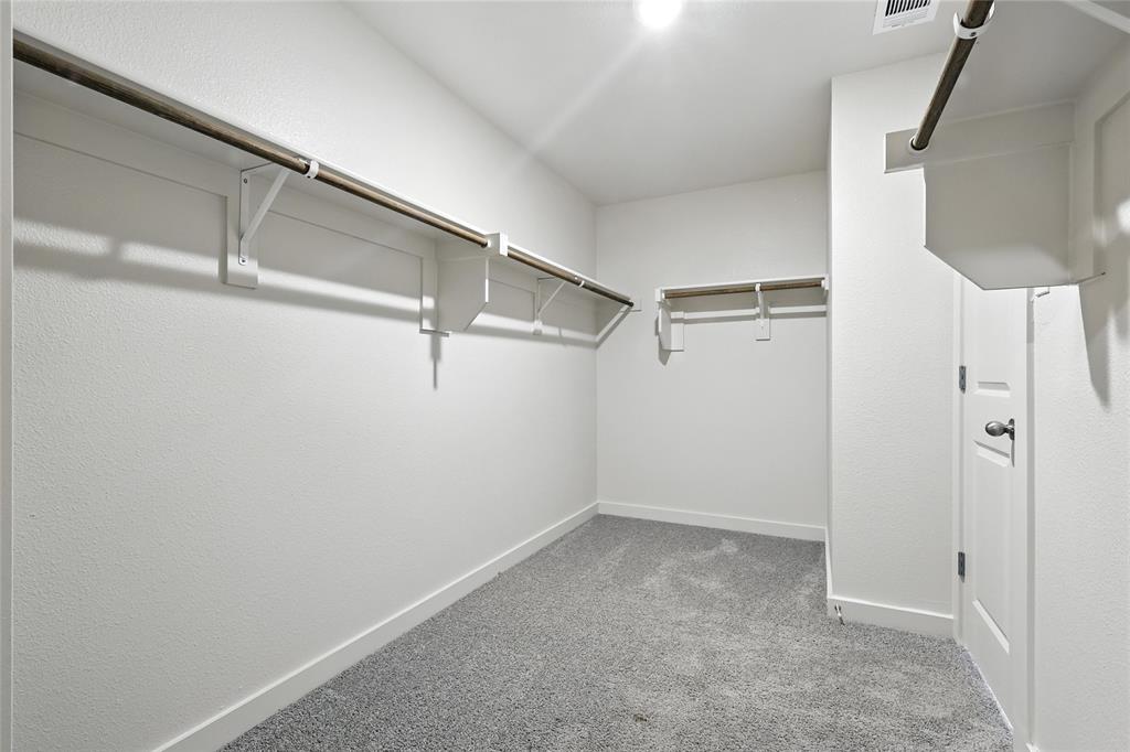 1795 Gleasondale Place Forney, TX 75126 - Photo 21 of 29 Walk in closet with carpet floors