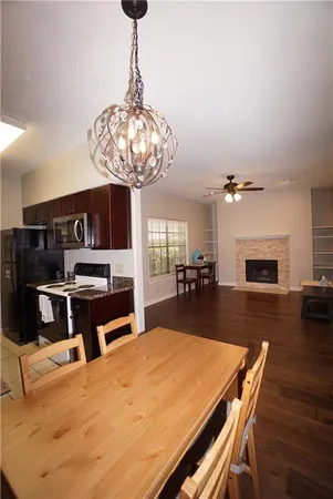 a kitchen with a table and chairs in it