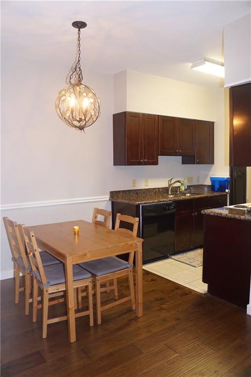 203 East 31st Street, Unit 103 Austin, TX 78705 - Photo 12 of 32 a kitchen with a table and chairs in it