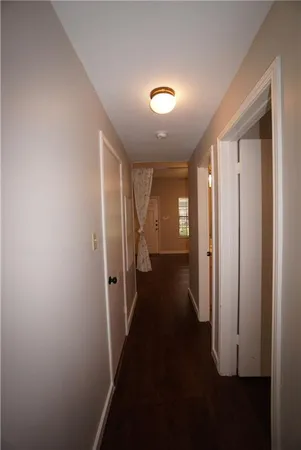 a bedroom with furniture and a wooden floor