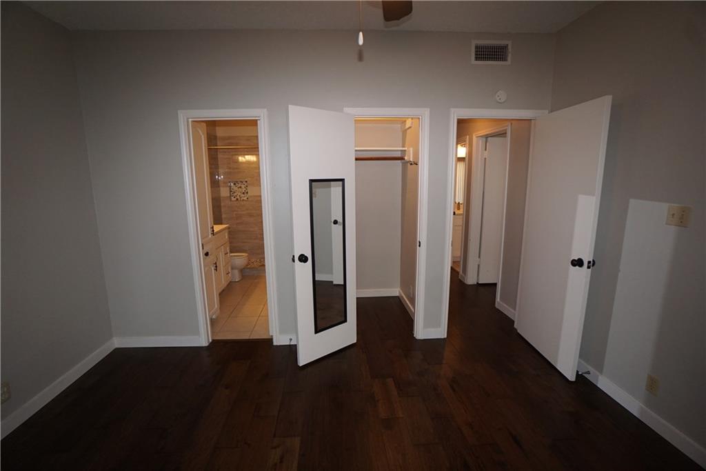 203 East 31st Street, Unit 103 Austin, TX 78705 - Photo 19 of 32 an empty room with wooden floor and closet