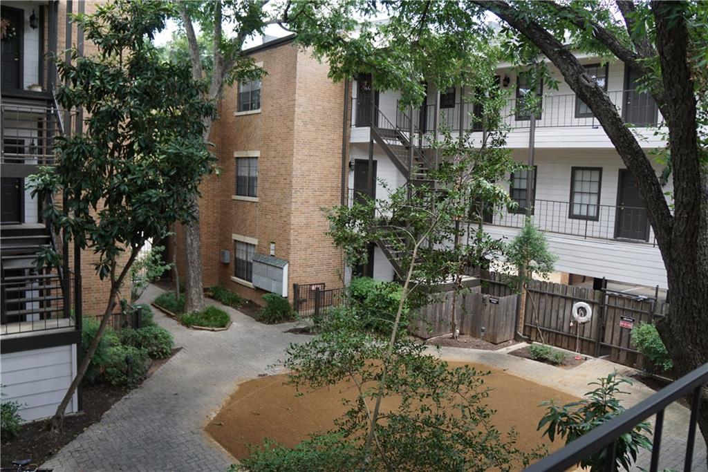 203 East 31st Street, Unit 103 Austin, TX 78705 - Photo 2 of 32 a view of a house with backyard and sitting area