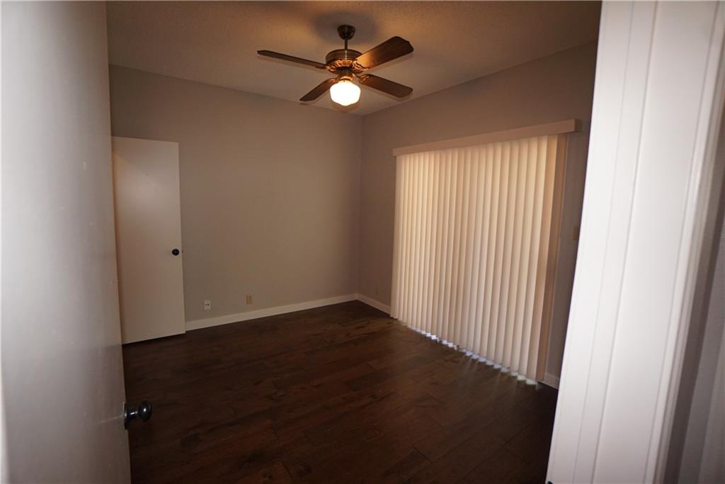 203 East 31st Street, Unit 103 Austin, TX 78705 - Photo 22 of 32 an empty room with a window and a ceiling fan