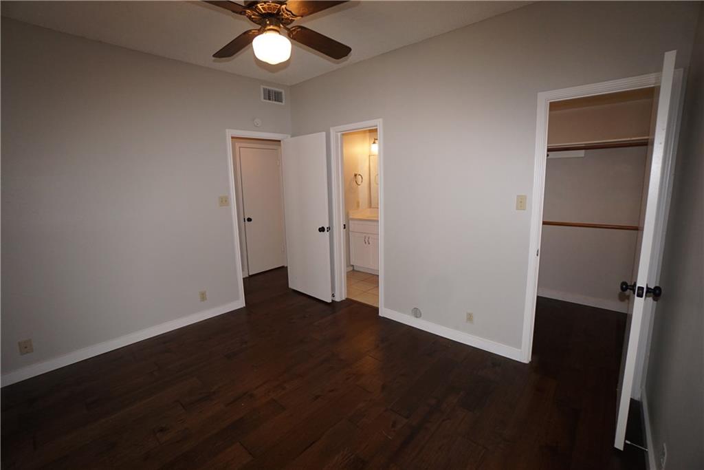 203 East 31st Street, Unit 103 Austin, TX 78705 - Photo 25 of 32 wooden floor in an empty room with a window