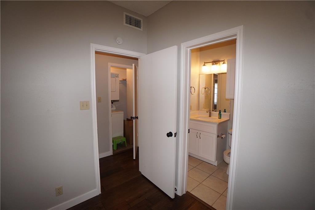 203 East 31st Street, Unit 103 Austin, TX 78705 - Photo 26 of 32 a view of a bathroom with a glass door